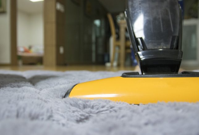 Vacuuming carpet
